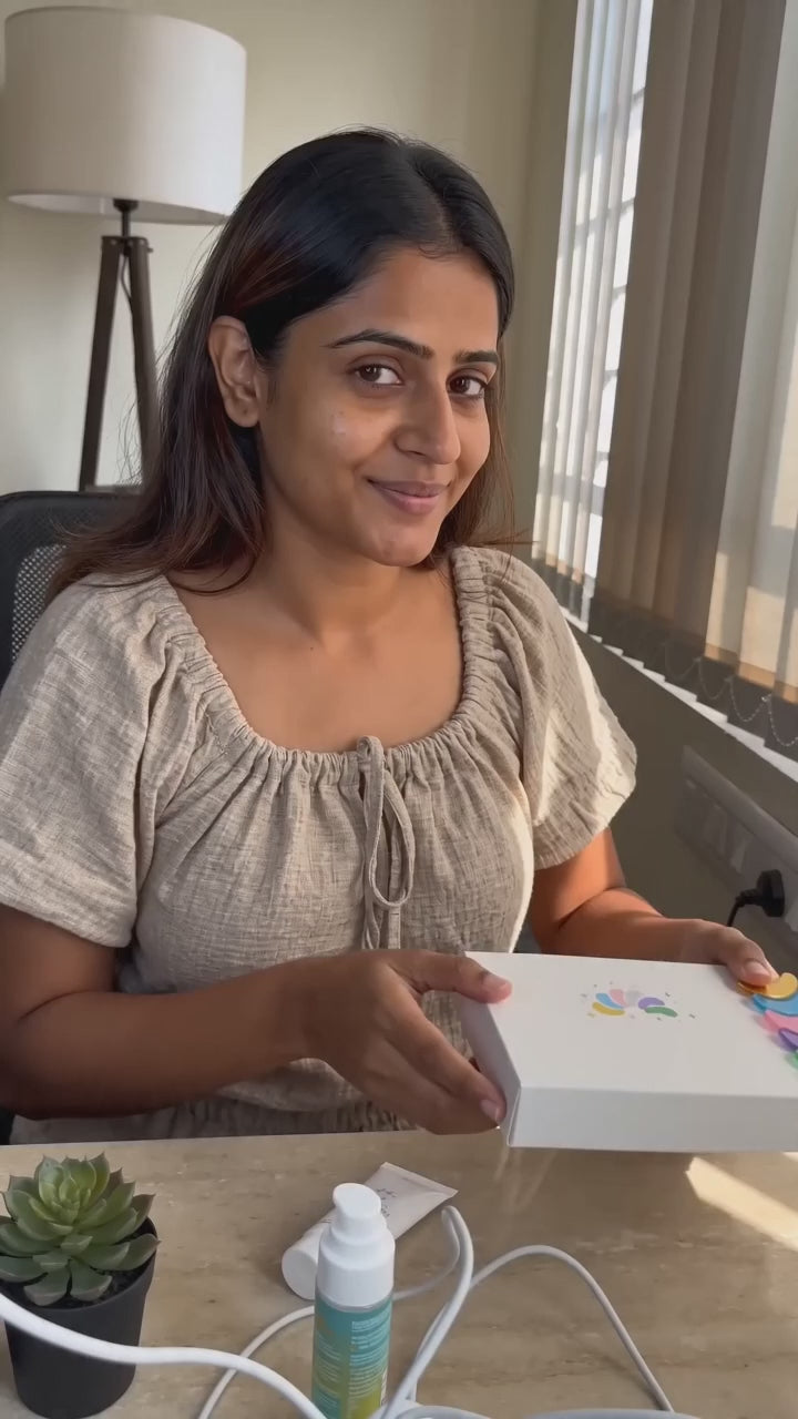 Indian woman applying Erilas gold under-eye patches from the tray, home tutorial UGC