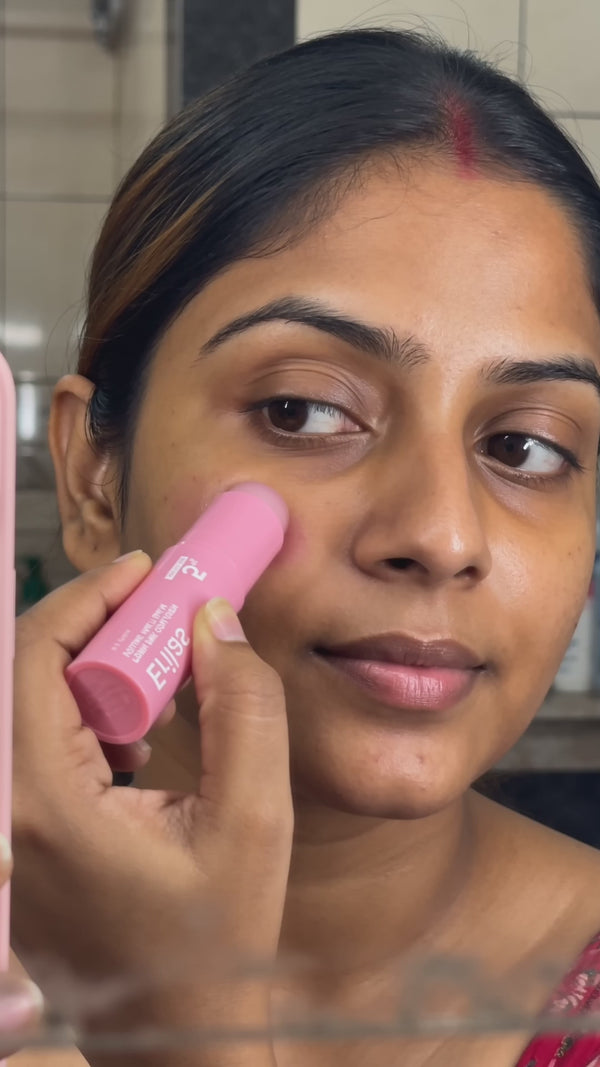 Indian woman bathroom mirror selfie gliding pink Erilas RoseVeil balm stick over cheek and lip